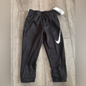 Nike Kids Black Joggers with White Swoosh